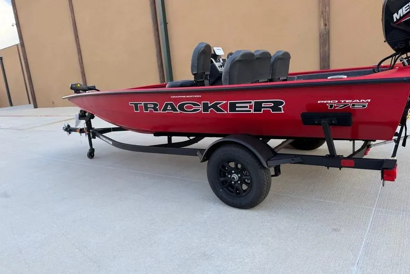 Slide: The Image of 2026 Tracker Pro Team 175 Crappie Edition boat on trailer, red exterior. - 4