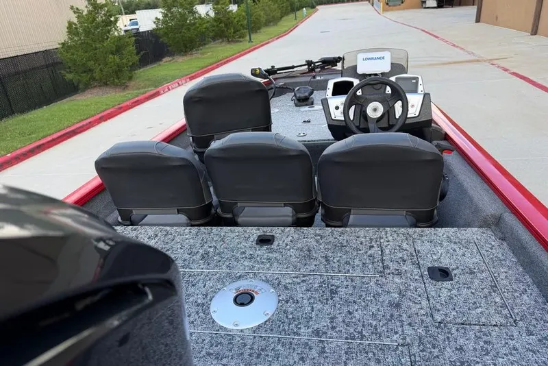 Slide: The Image of 2026 Tracker Pro Team 175 Crappie Edition boat interior with steering wheel and seating. - 6