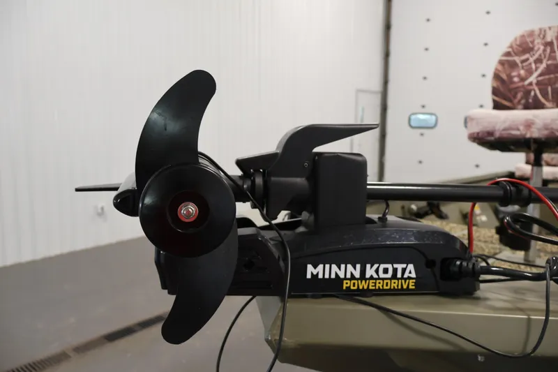 Slide: The Image of Minn Kota PowerDrive motor on 2014 Lowe Roughneck 1756 boat, indoor setting. - 12