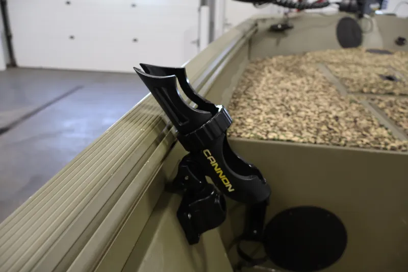Slide: The Image of Rod holder on 2014 Lowe Roughneck 1756 boat, featuring camouflage interior design. - 19