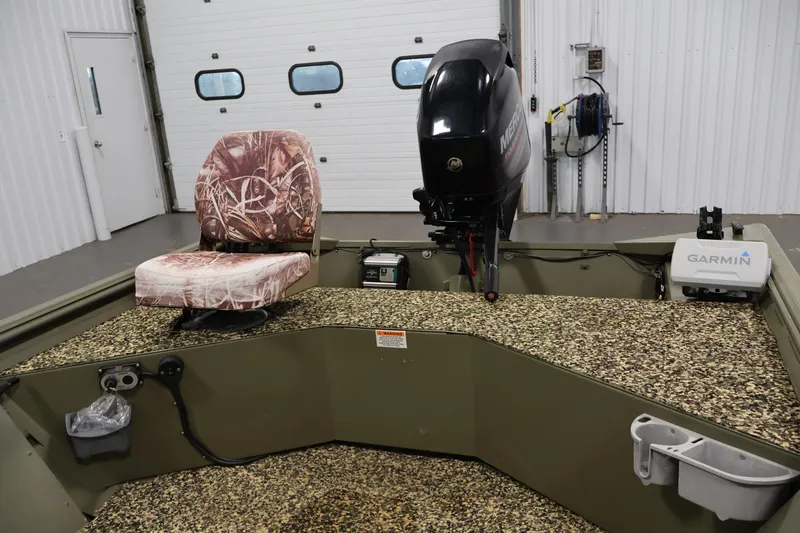 Slide: The Image of 2014 Lowe Roughneck 1756 boat interior with camo seat and Garmin equipment. - 20