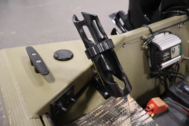 Slide: The Image of 2014 Lowe Roughneck 1756 boat interior with rod holder and control panel. - 23
