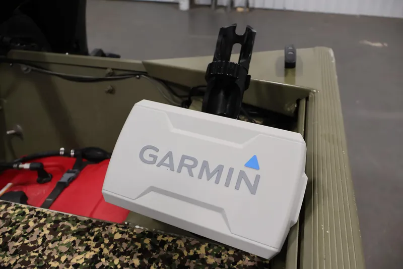 Slide: The Image of Garmin device on 2014 Lowe Roughneck 1756 boat, camouflage interior visible. - 25