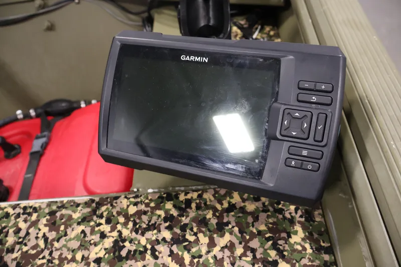 Slide: The Image of Garmin device on 2014 Lowe Roughneck 1756 boat with camouflage interior. - 26