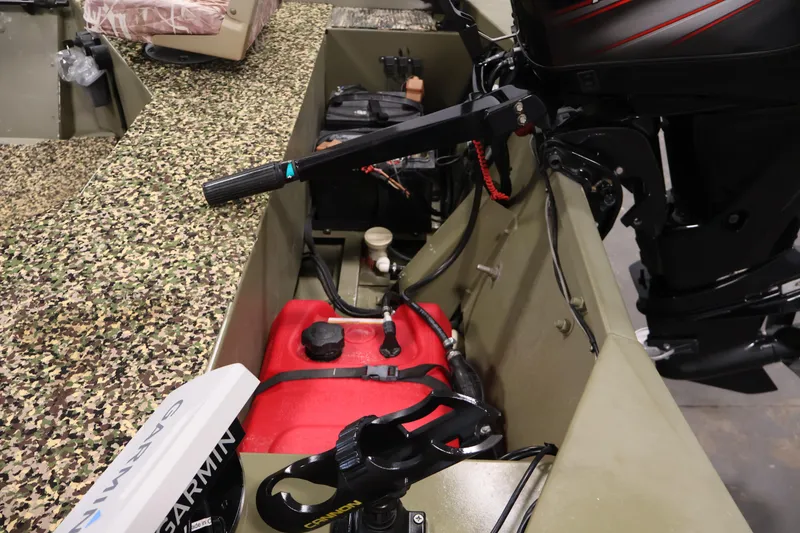 Slide: The Image of 2014 Lowe Roughneck 1756 boat interior with motor and equipment. - 27
