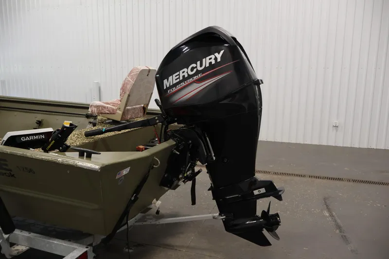 Slide: The Image of 2014 Lowe Roughneck 1756 boat with Mercury FourStroke outboard motor in a garage setting. - 28