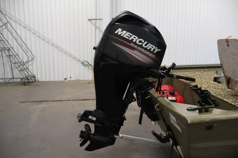 Slide: The Image of 2014 Lowe Roughneck 1756 boat with Mercury FourStroke outboard motor in a garage. - 29