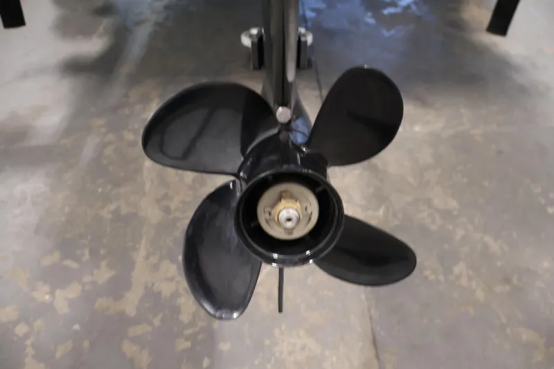 Slide: The Image of Close-up of a 2014 Lowe Roughneck 1756 boat propeller on a concrete floor. - 31