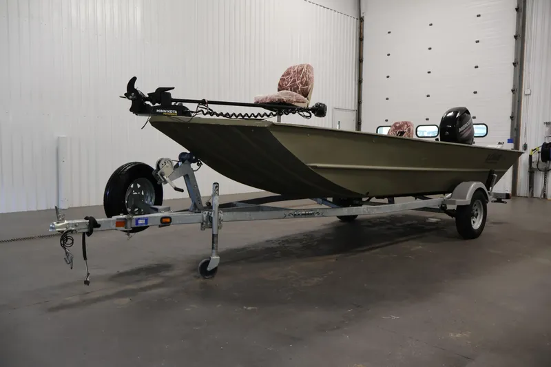 Slide: The Image of 2014 Lowe Roughneck 1756 boat on trailer in indoor garage setting. - 34