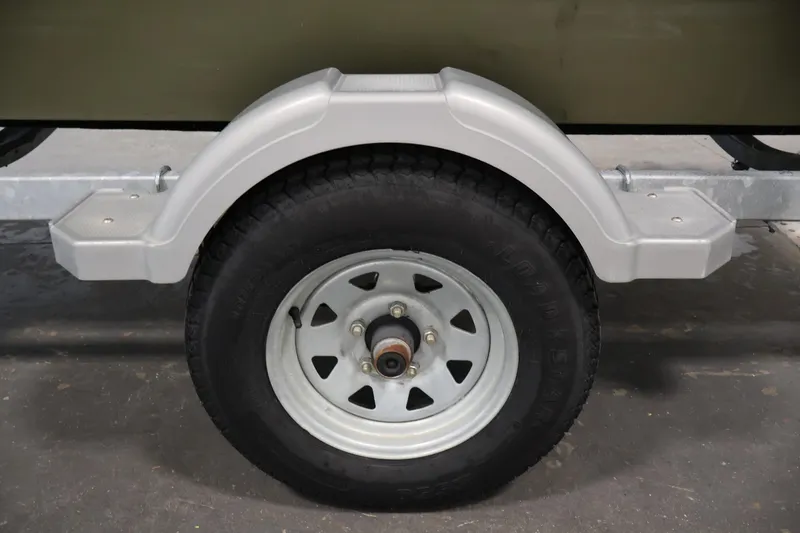 Slide: The Image of Trailer wheel and fender of a 2014 Lowe Roughneck 1756 boat. - 35