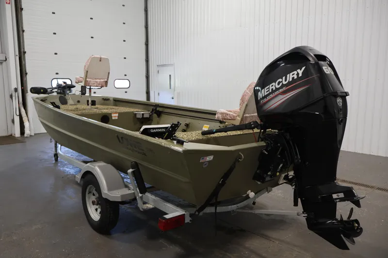 Slide: The Image of 2014 Lowe Roughneck 1756 boat with Mercury engine on trailer in garage. - 7