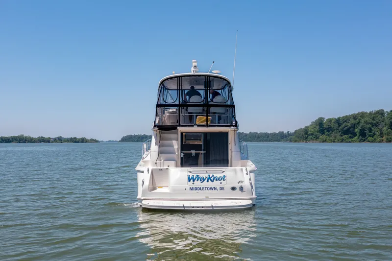 Slide: The Image of 2003 Sea Ray 480 Sedan Bridge on calm waters. - 10