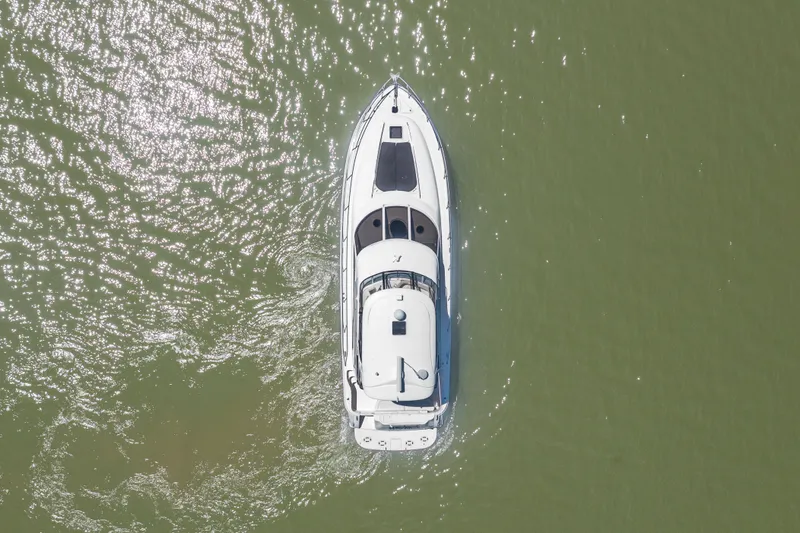 Slide: The Image of Aerial view of 2003 Sea Ray 480 Sedan Bridge on calm water. - 21