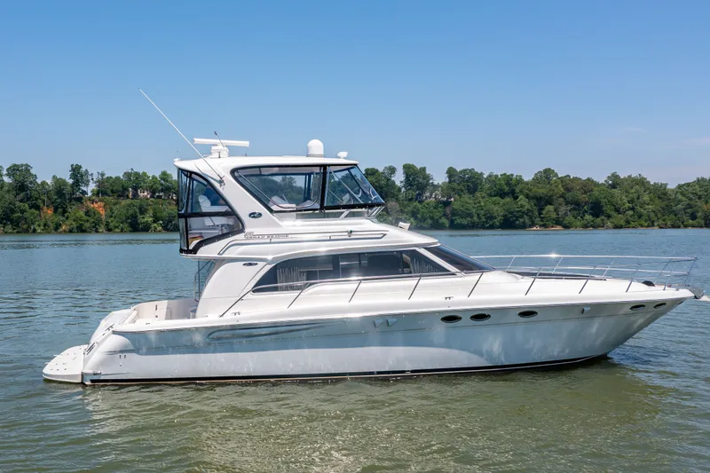 Slide: The Image of 2003 Sea Ray 480 Sedan Bridge on calm water. - 23
