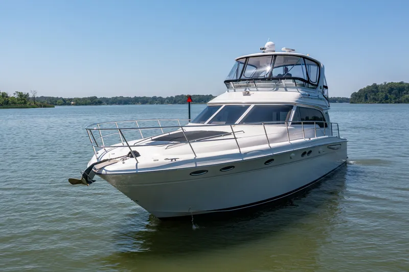Slide: The Image of 2003 Sea Ray 480 Sedan Bridge on calm water. - 26