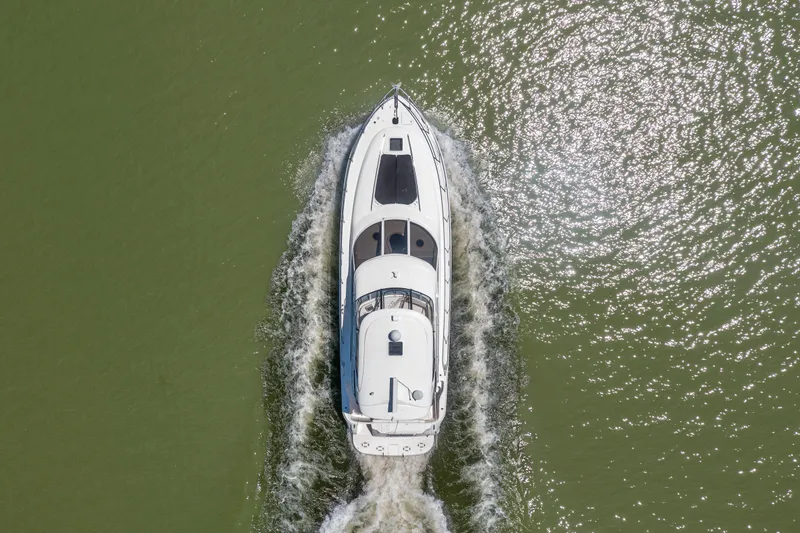 Slide: The Image of Aerial view of a 2003 Sea Ray 480 Sedan Bridge on water. - 28