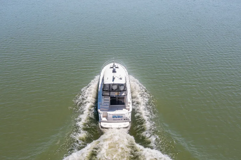 Slide: The Image of 2003 Sea Ray 480 Sedan Bridge cruising on calm waters. - 29