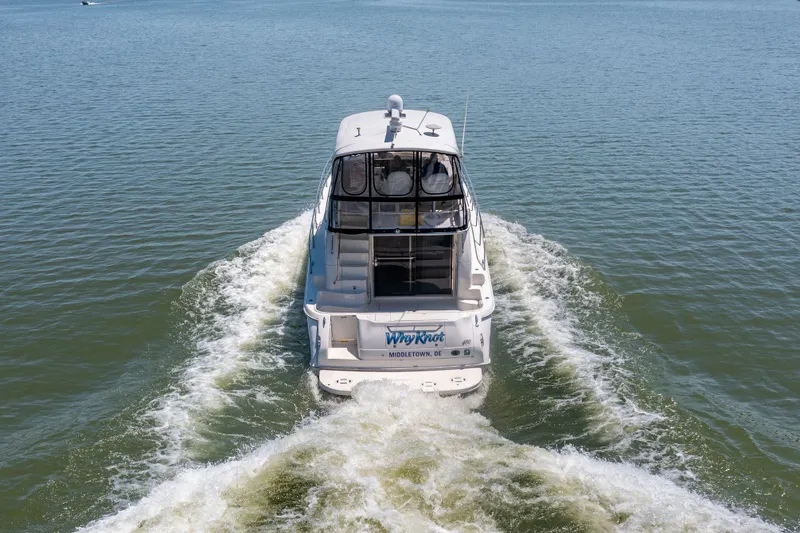 Slide: The Image of 2003 Sea Ray 480 Sedan Bridge on water, rear view. - 30