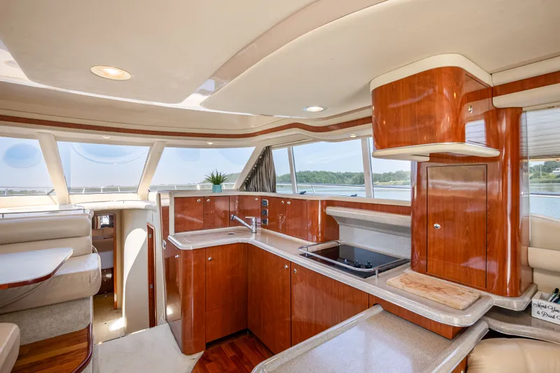 Slide: The Image of Interior of 2003 Sea Ray 480 Sedan Bridge with modern kitchen. - 34