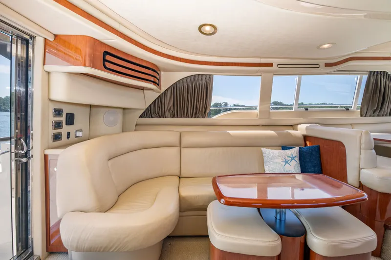 Slide: The Image of Luxurious interior of the 2003 Sea Ray 480 Sedan Bridge. - 36