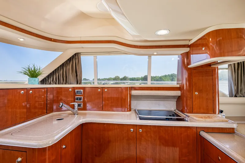 Slide: The Image of Interior of 2003 Sea Ray 480 Sedan Bridge with elegant kitchen. - 38