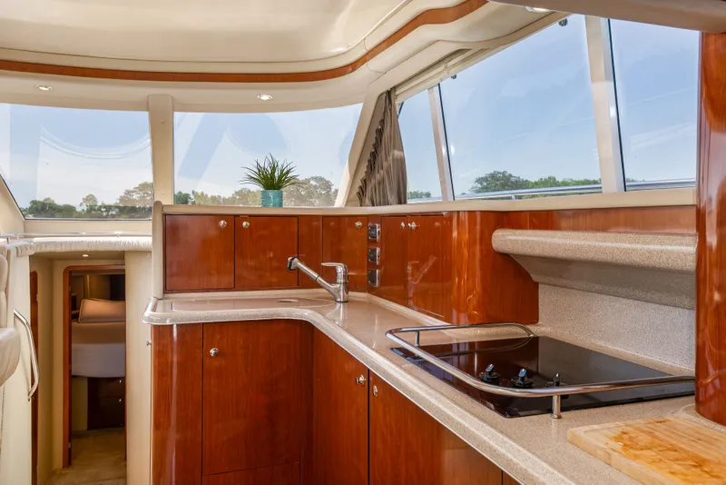 Slide: The Image of Interior of 2003 Sea Ray 480 Sedan Bridge with modern kitchen. - 41