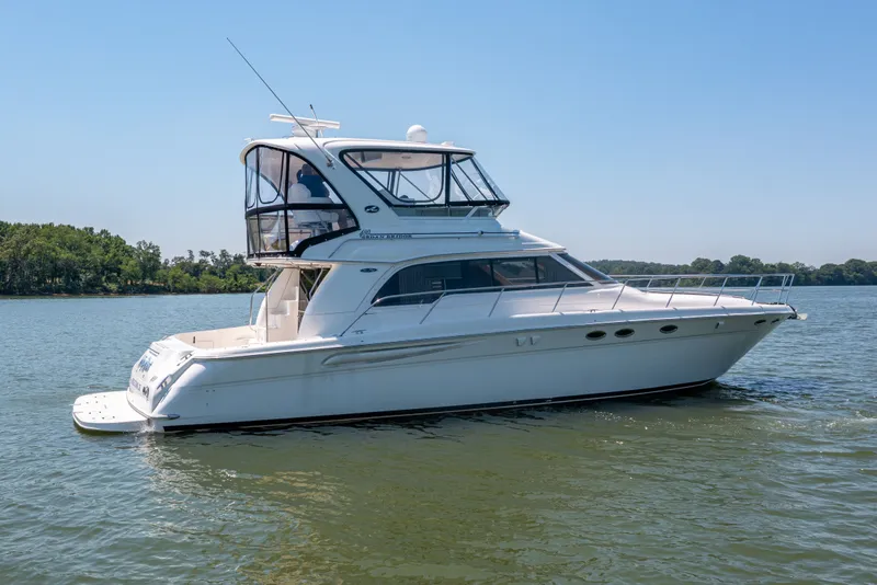 Slide: The Image of 2003 Sea Ray 480 Sedan Bridge on calm water. - 6