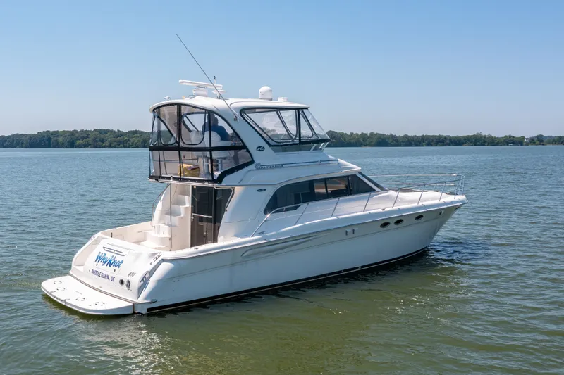 Slide: The Image of 2003 Sea Ray 480 Sedan Bridge on calm waters. - 8