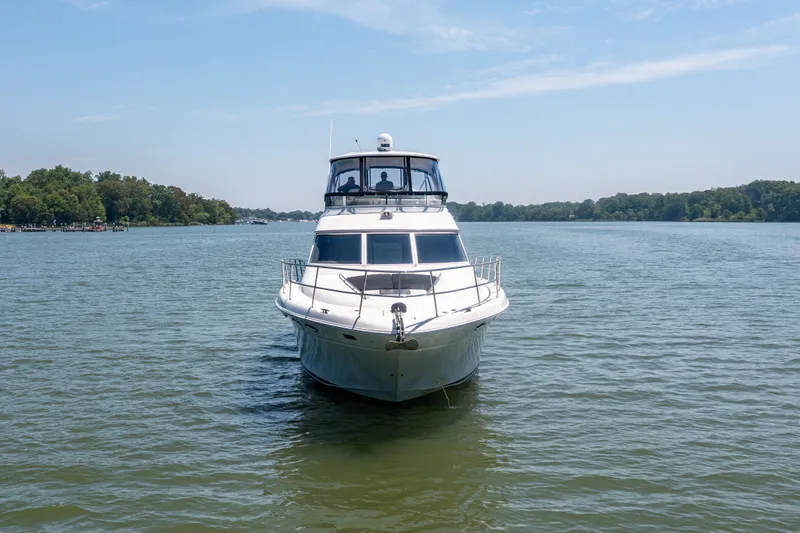 Slide: The Image of 2003 Sea Ray 480 Sedan Bridge on calm waters. - 9