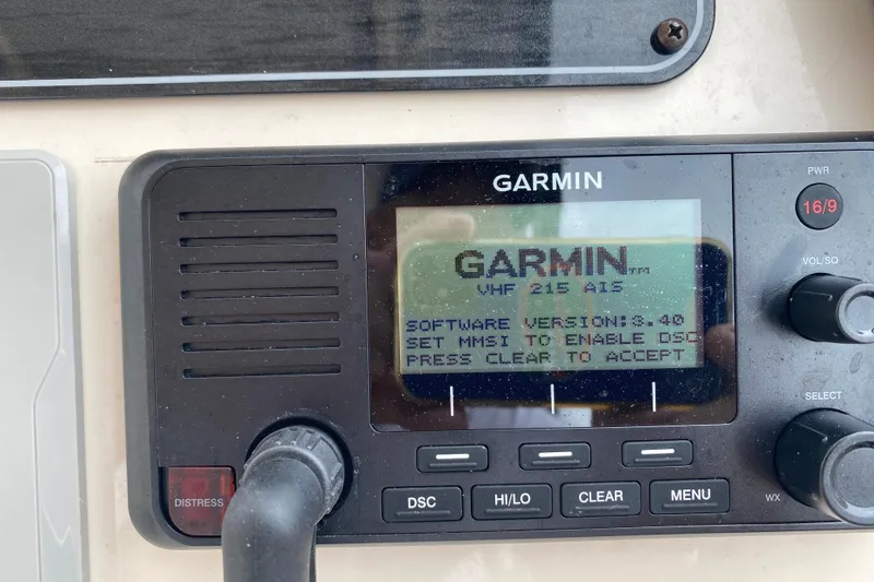 Slide: The Image of Garmin VHF 215 AIS radio display on 2025 Grady-White Freedom 307 boat. - 13