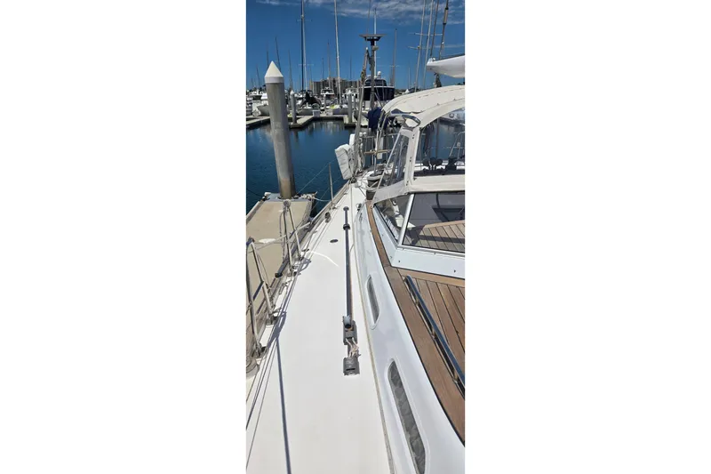 Slide: The Image of Sailboat docked at marina, Contest 46/48 model, 1995, with clear skies. - 17