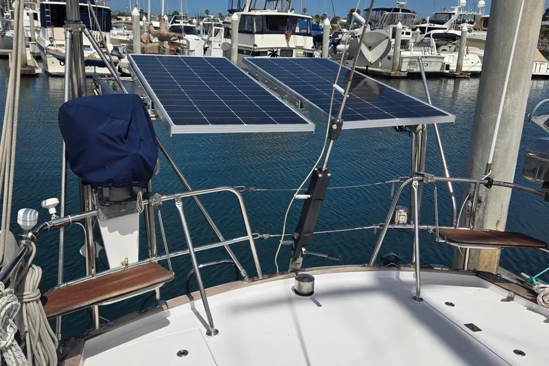 Slide: The Image of Sailboat with solar panels in marina, Contest 46/48 model, 1995. - 11