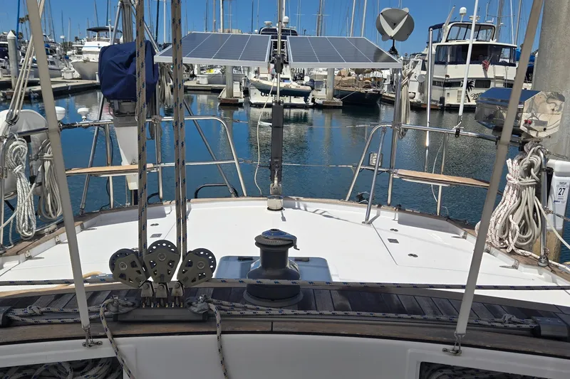 Slide: The Image of Sailboat deck view with solar panels, docked in a marina, Contest 46/48, 1995 model. - 15