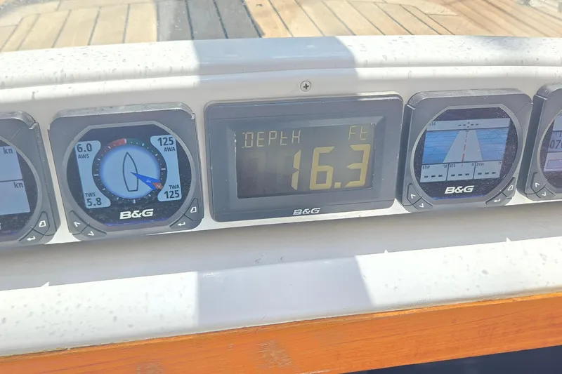 Slide: The Image of Sailing instrument panel on a 1995 Contest 46/48 yacht displaying depth and wind data. - 9