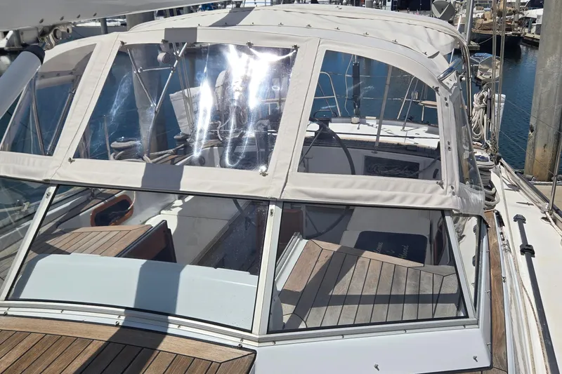 Slide: The Image of Sailboat cockpit with clear canopy, Contest 46/48 model, 1995, docked at marina. - 16