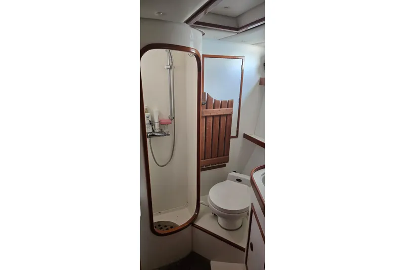 Slide: The Image of Bathroom interior of 1995 Contest 46/48 yacht with shower and toilet. - 25