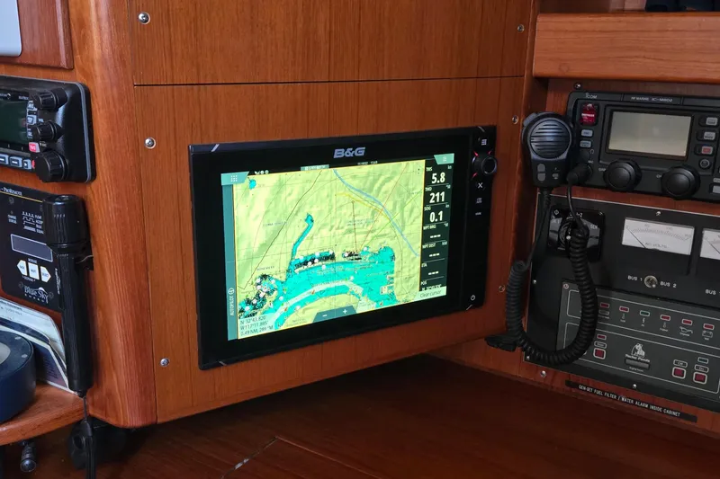 Slide: The Image of Navigation equipment on a 1995 Contest 46/48 yacht, featuring a B&G display and communication devices. - 32