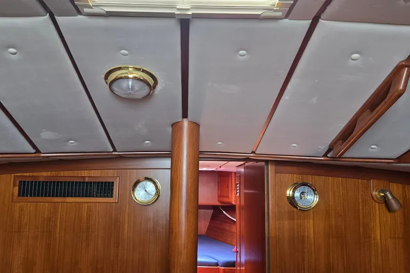 Slide: The Image of Interior of a 1995 Contest 46/48 yacht with wood paneling and ceiling details. - 37