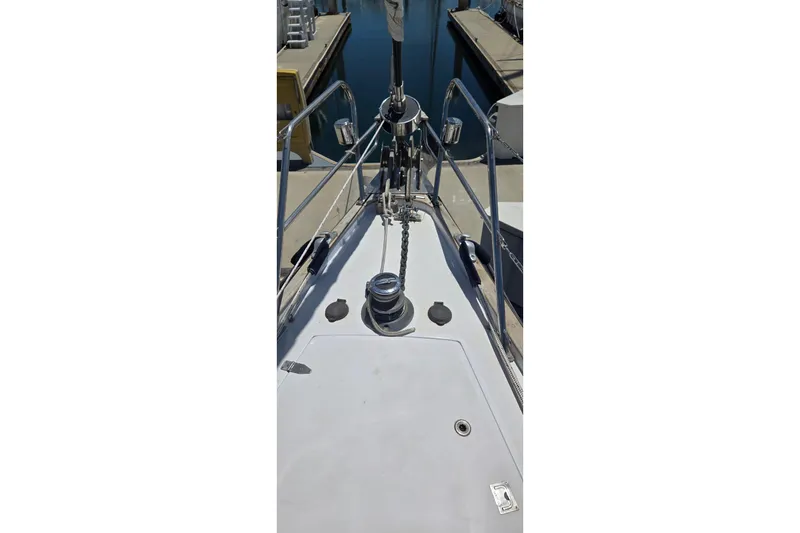 Slide: The Image of Bow view of a 1995 Contest 46/48 yacht docked at a marina. - 12