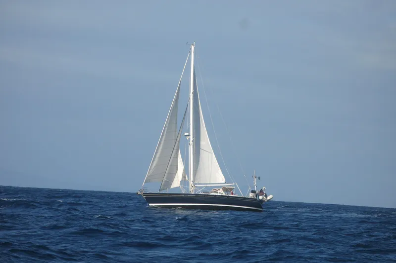 The Image of Sailing yacht Contest 46/48 from 1996 navigating open sea under clear skies. - 0