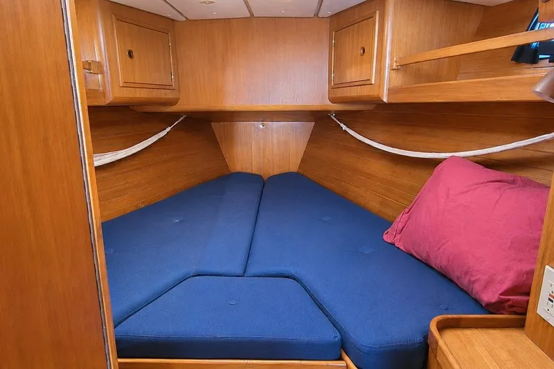 Slide: The Image of Cozy cabin interior of 1996 Contest 46/48 yacht with blue cushions and wooden finish. - 29