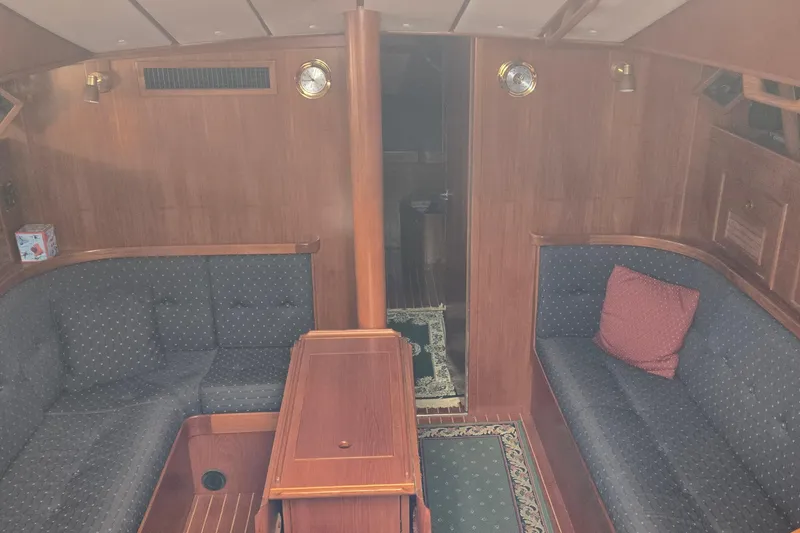 Slide: The Image of Luxurious 1996 Contest 46/48 yacht interior with elegant wood finish and cozy seating. - 10
