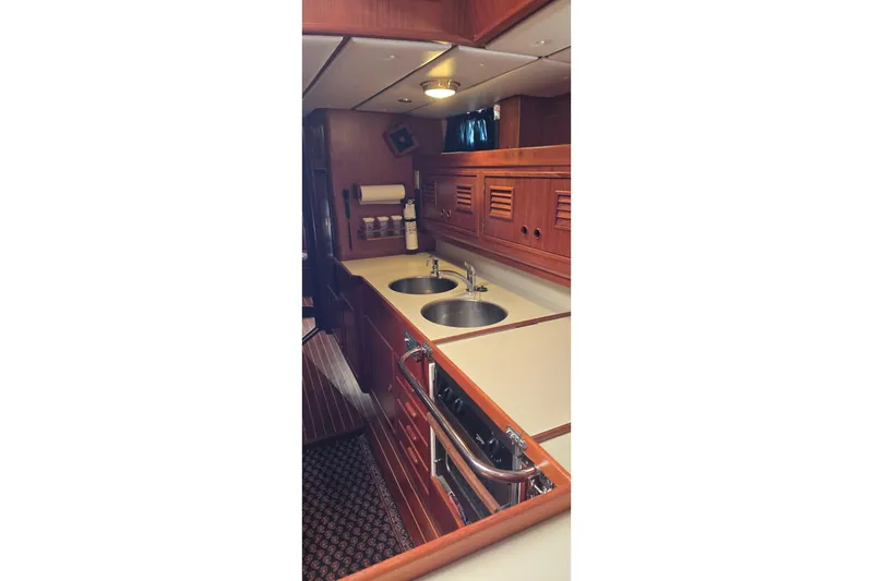 Slide: The Image of Luxurious 1996 Contest 46/48 yacht interior with wooden cabinetry and dual sinks. - 14