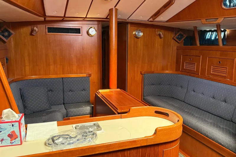 Slide: The Image of Luxurious 1996 Contest 46/48 yacht interior with wooden paneling and plush seating. - 15
