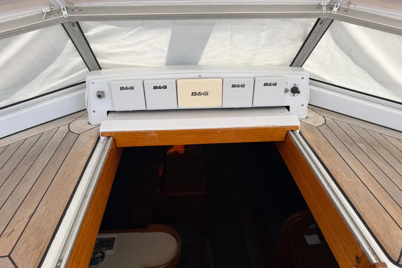 Slide: The Image of 1996 Contest 46/48 yacht cockpit with B&G navigation instruments and wooden hatch. - 16