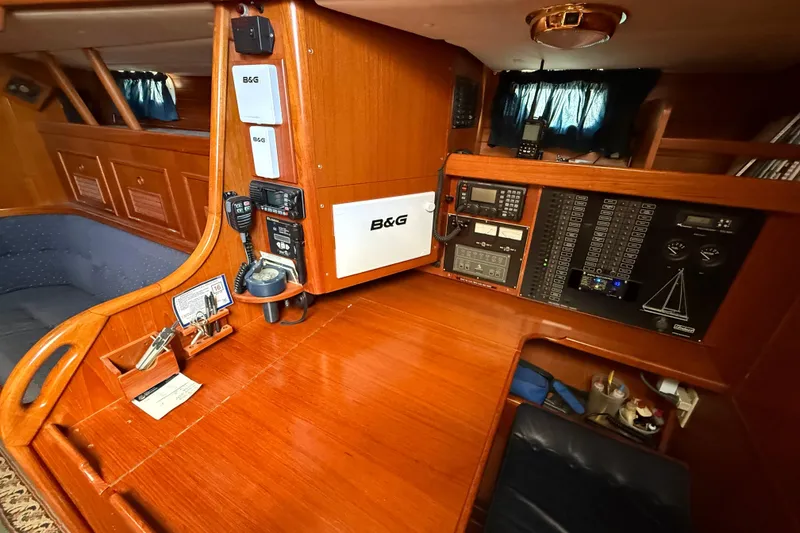 Slide: The Image of Navigation station of a 1996 Contest 46/48 yacht with control panels and equipment. - 21