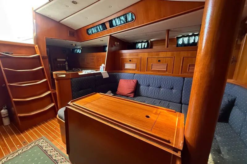 Slide: The Image of Luxurious 1996 Contest 46/48 yacht interior with wooden finishes and cozy seating area. - 23