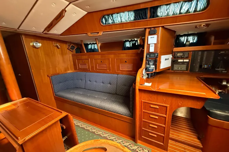 Slide: The Image of Luxurious 1996 Contest 46/48 yacht interior with wooden furnishings and navigation equipment. - 25
