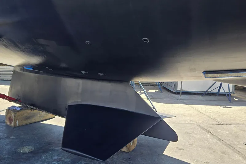 Slide: The Image of Bottom view of a 1996 Contest 46/48 yacht hull and keel in a shipyard. - 3
