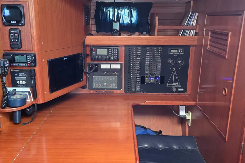 Slide: The Image of Navigation station of a 1996 Contest 46/48 yacht with control panels and communication equipment. - 7